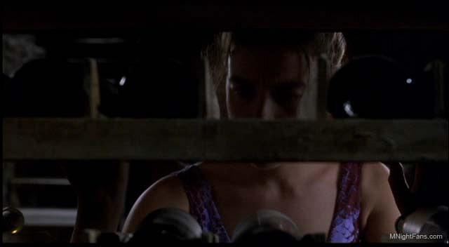 Olivia Williams as Anna Crowe selecting a wine