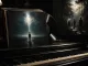Moody piano keys and soundtrack imagery in deep shadow for a Shyamalan soundtrack guide.
